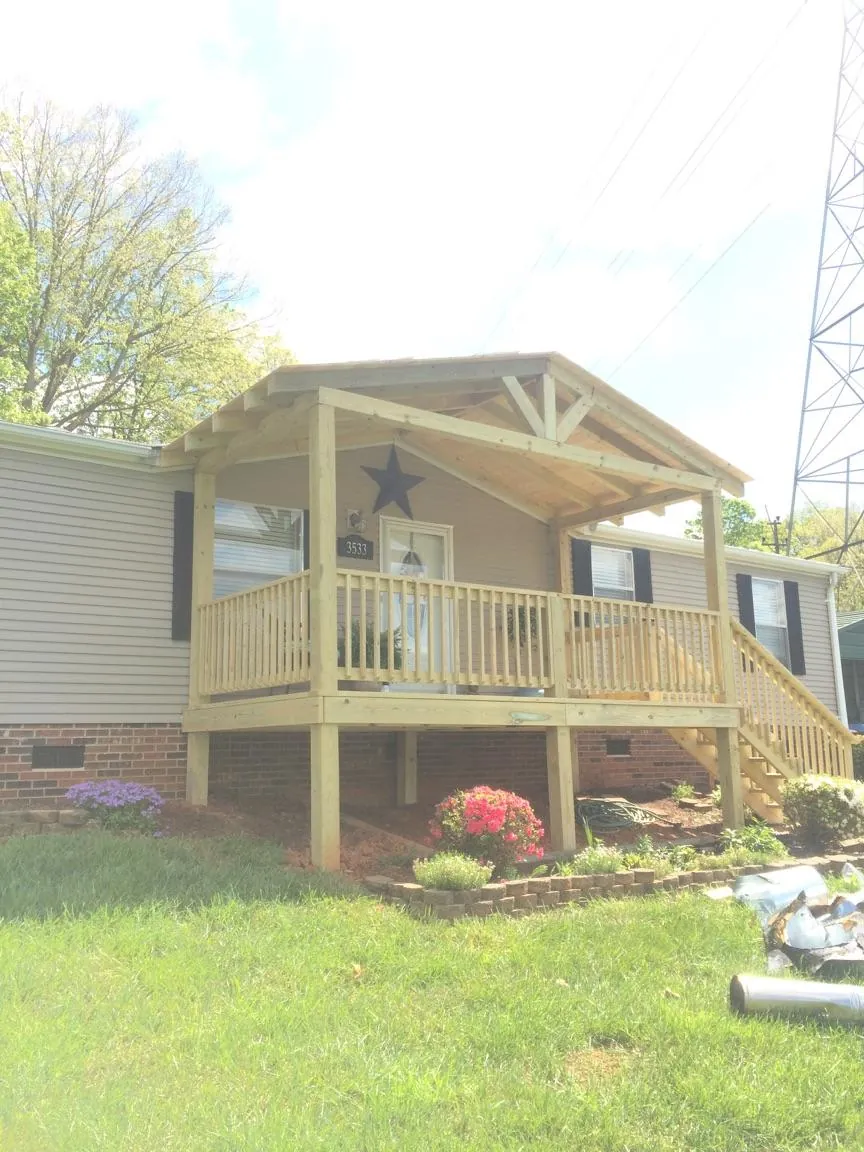 New gabled porch roof and deck railing added to a ranch home in Pottstown